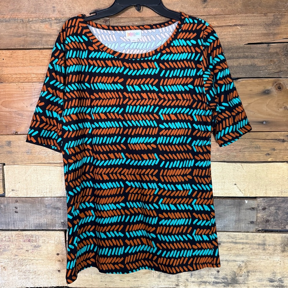 LuLaRoe Gigi fitted top in a black, orange and turquoise abstract pattern Medium